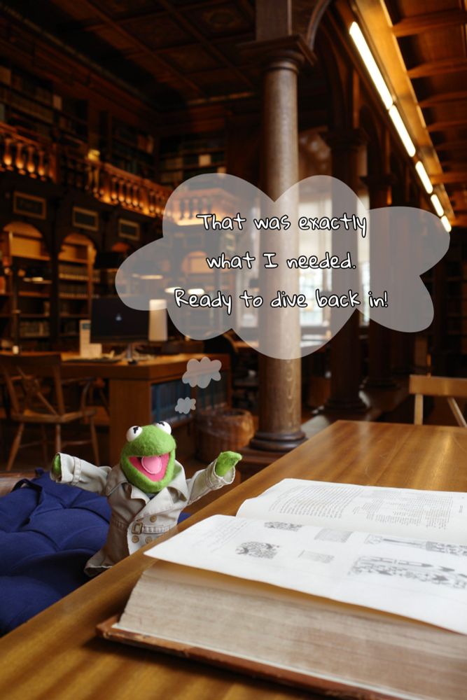 Kermit from the same angle as the first two photos, with the same weighty tome open in front of his raised arms and smiling face. In a thought bubble: 'That was exactly what I needed. Ready to dive back in!'