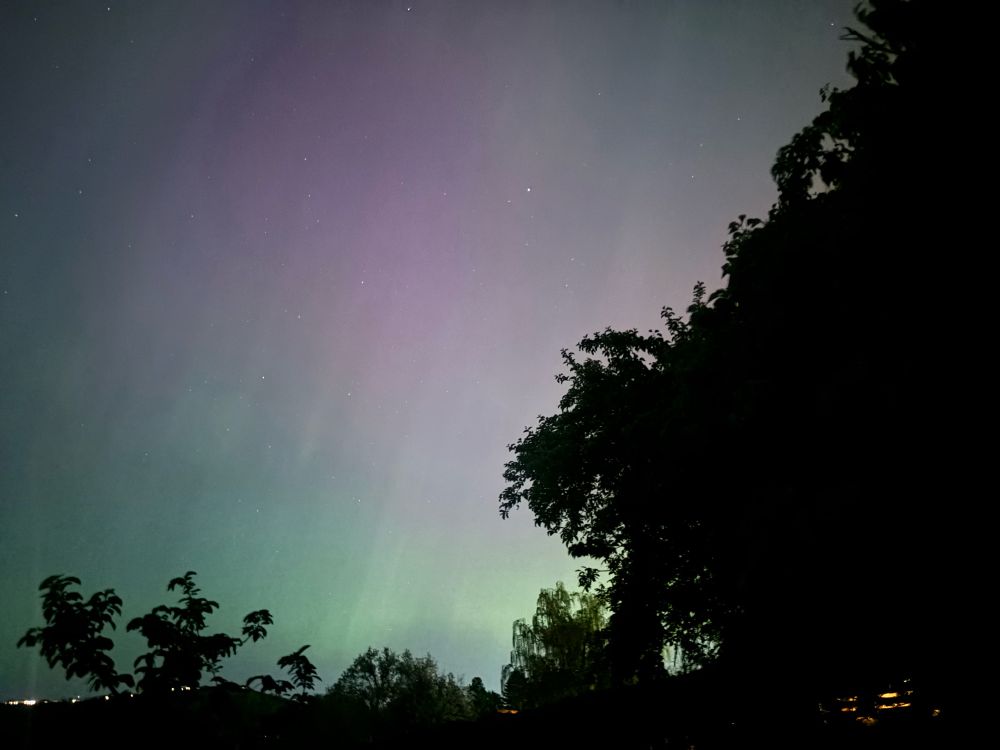 Diffuse reddish and greenish colors in the sky from the Northern Lights as photographed on 10-May-2024 in Eastern Washington.