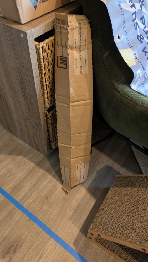 a damaged shipping box that looks like it was squashed during transit