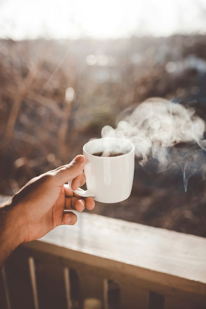 Hand with a cup of coffee