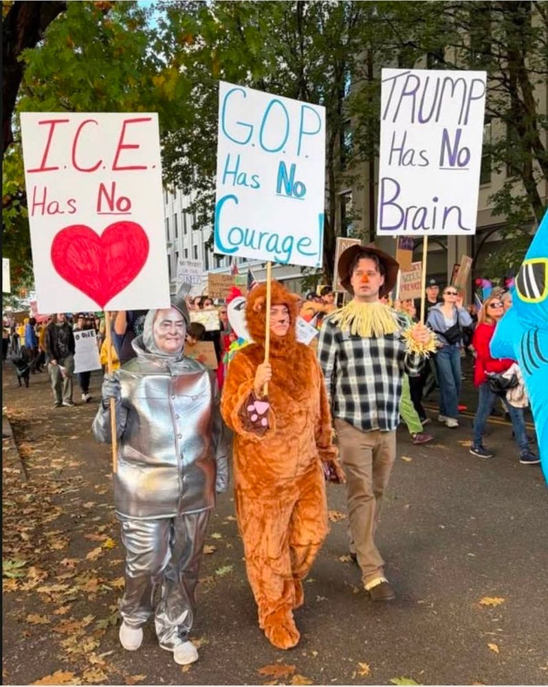 The lion, the scarecrow and the tin man, all holding signs about ice.The g o p and trump, you can figure out the details