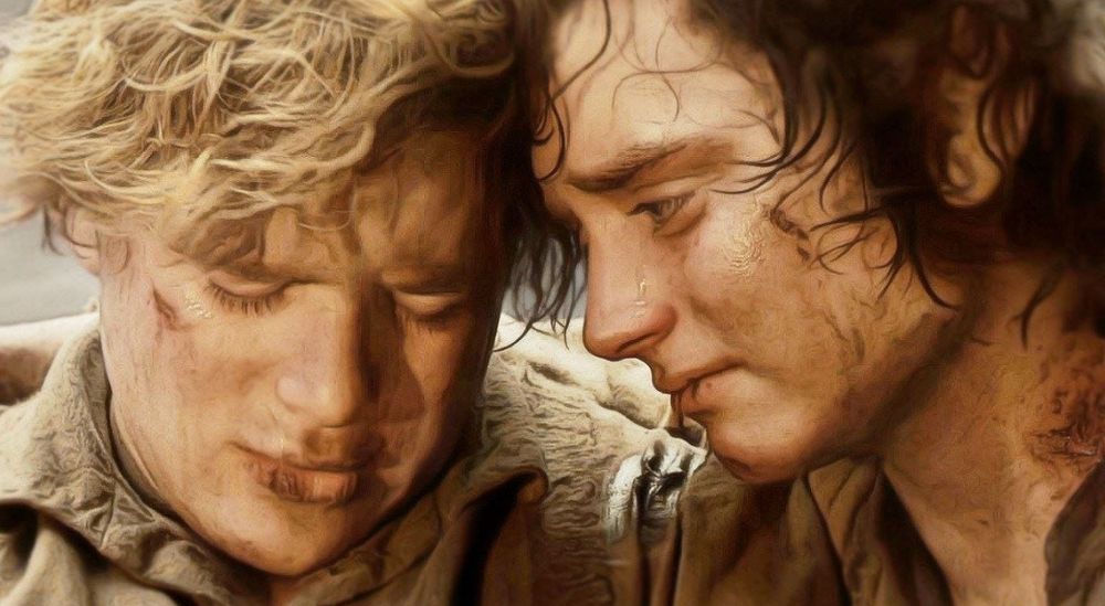 Photo of Sam and Frodo from Lord of the Rings. They look sad and their foreheads are touching. 