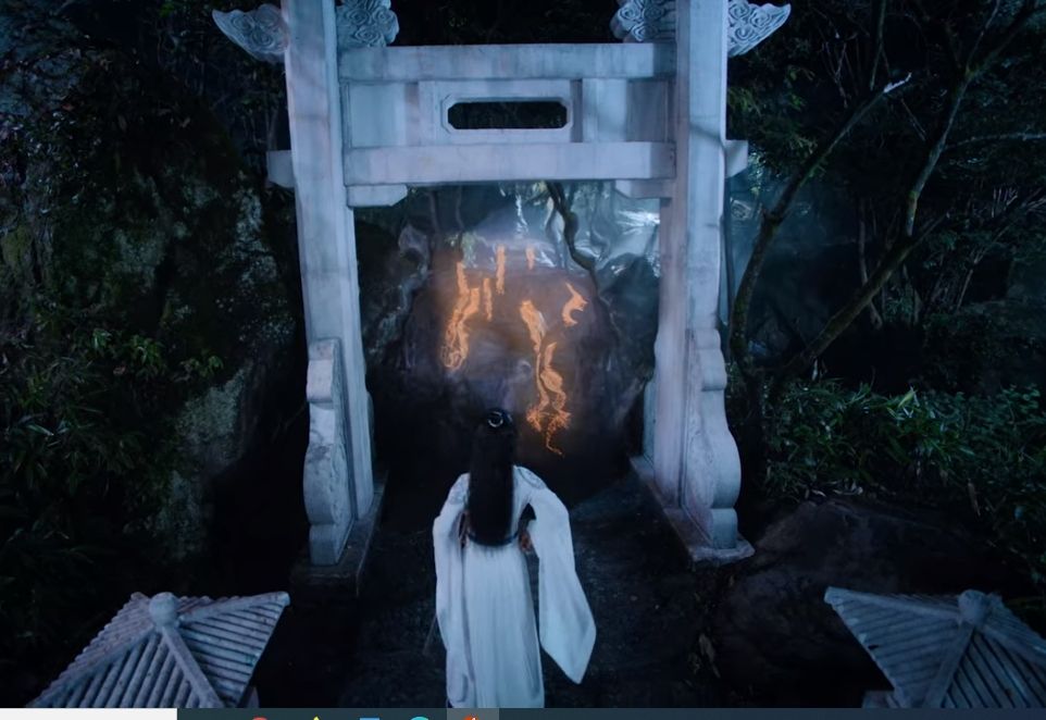 Wei Wuxian (actor Xiao Zhan) (in white robes) breaking in to Cloud Recesses by using a talisman against the wards. 