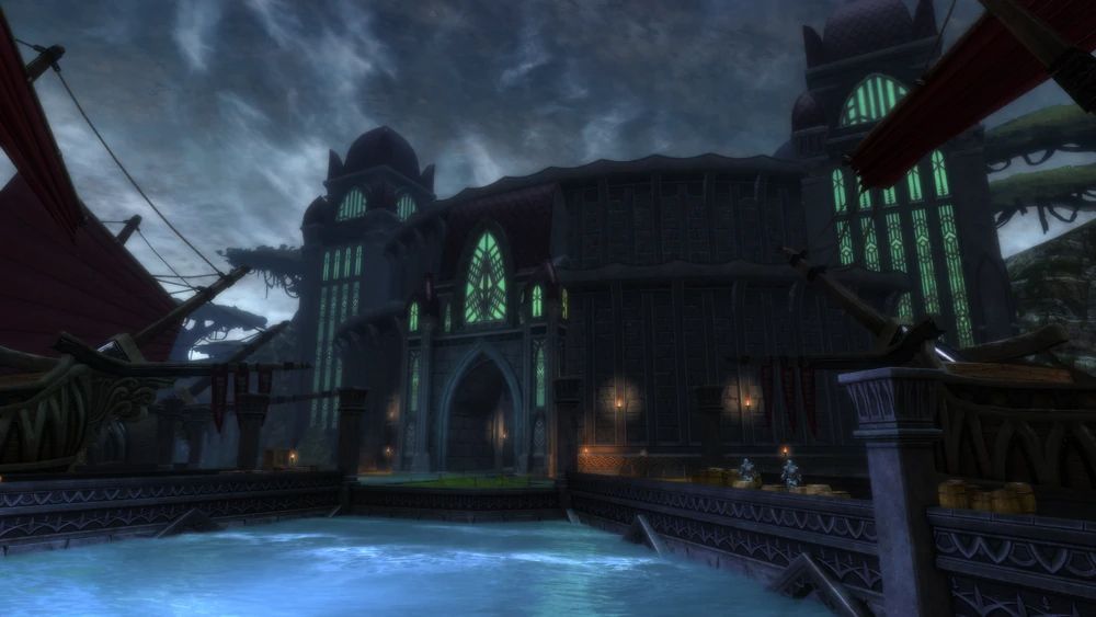 A gothic looking building with glowing green windows overlooking a pier with glowing light blue water, with a gloomy, stormy backdrop.