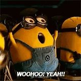 a group of minions are standing next to each other and one of them is saying woohoo yeah .