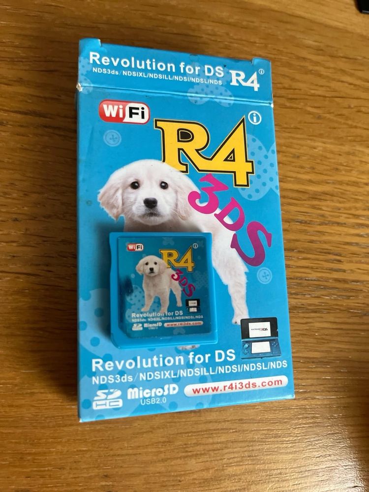 An R4 3DS flashcart with a puppy on the box and the game card