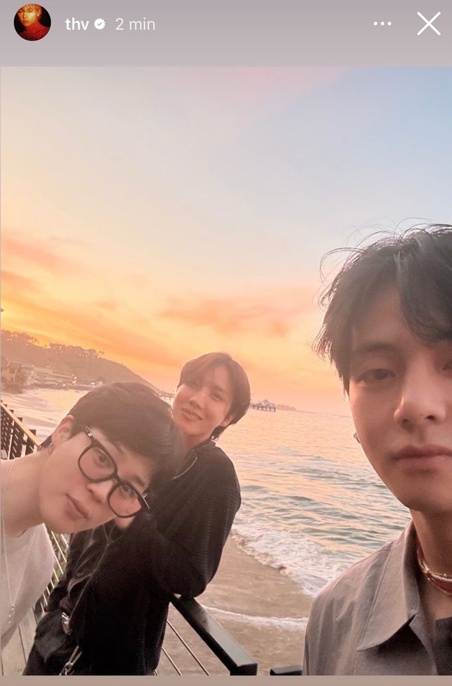 vminhope selca near a balcony by a beach. The sun seems to be setting in the back. Hobi is by the balcony smiling, Jimin’s head cutely pops out from the left and we cannot see Tae’s whole face but enough to see him looking handsome with his golden skin shining 
