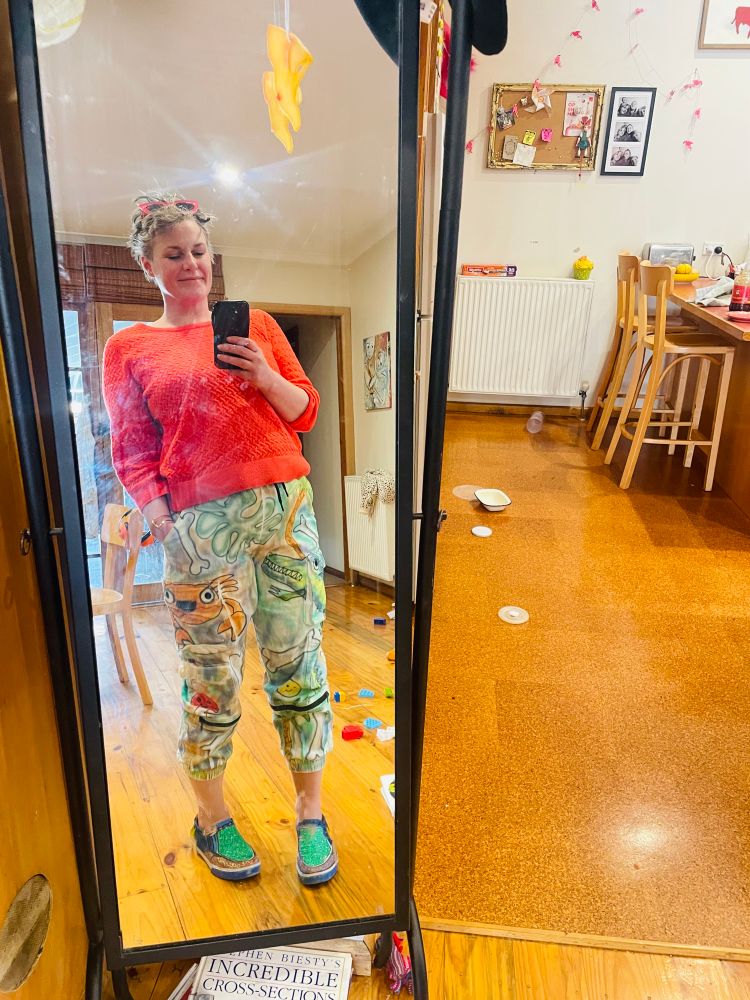 Coral knit top and spraypainted cargo shorts with crabs and sea creatures all over them and 
Hand painted brightly coloured loafers
