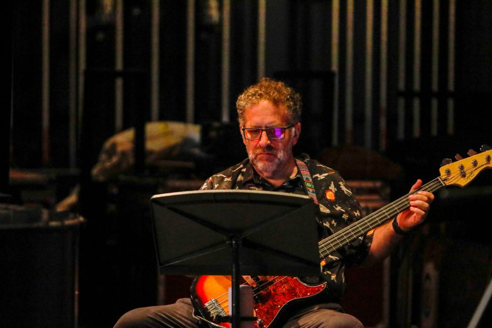 Me playing fretless electric bass for a musical.