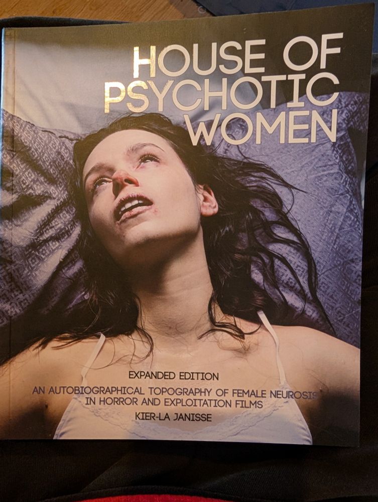 Photo of the book "House of Psychotic Women", the expanded edition. Written by Kier-La Janisse. The cover has an image from Starry Eyes on it. 