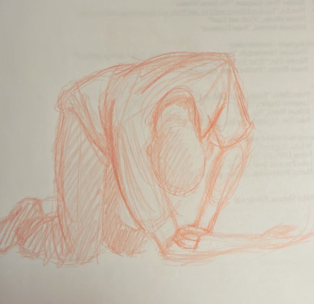 Red pencil on scrap paper drawing of a man on their hands and knees 