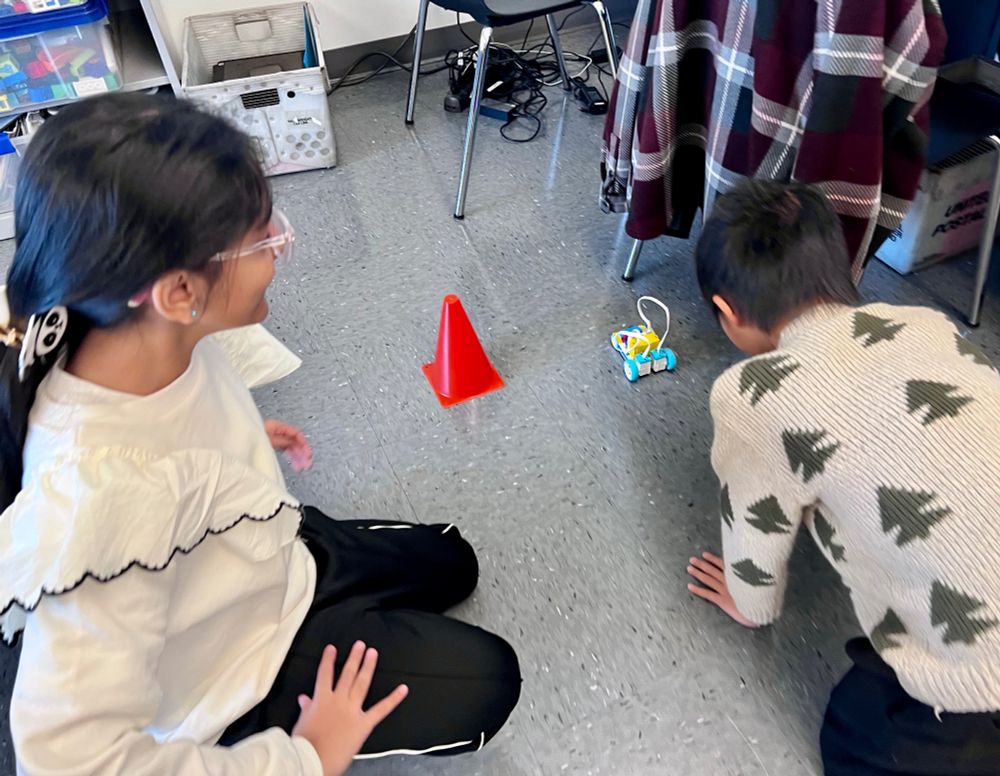 kids with lego robot