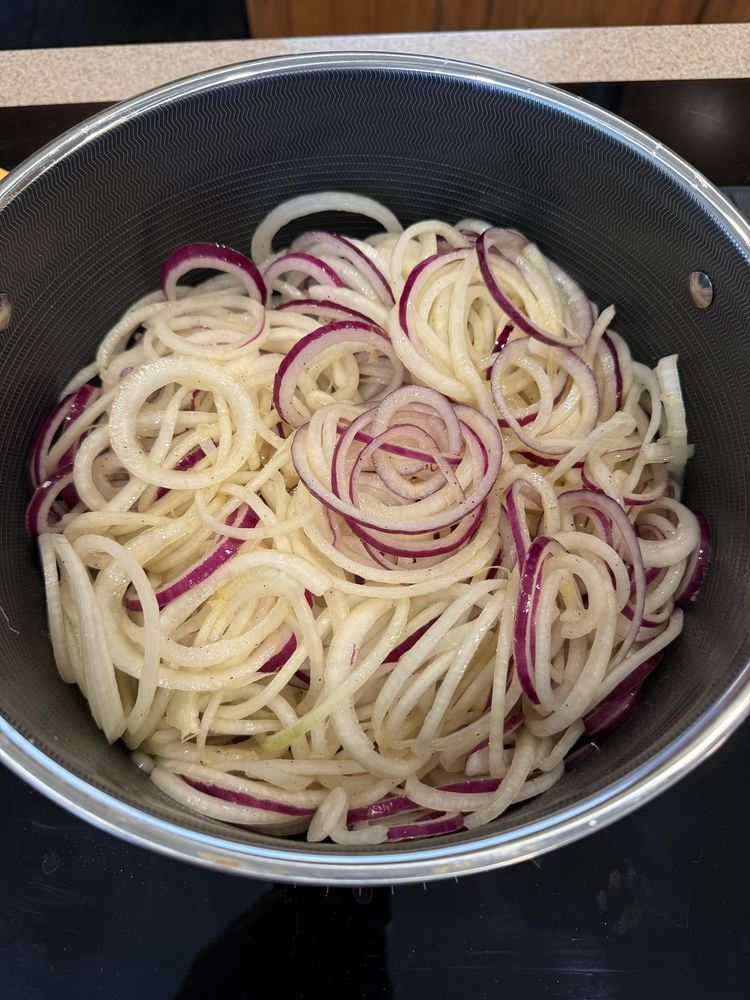 All onions from prior photo in a pot getting ready to start cooking down