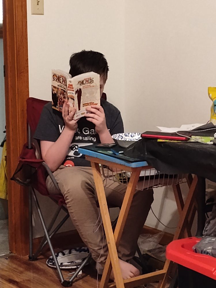 My boy demonstrating his opinion of school work this morning.