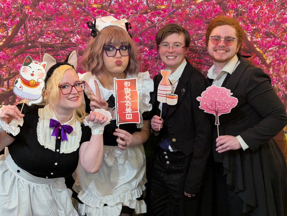 Princess Cakeroll, Nova Auron, Princes Alice & Sheer Madness pose in front of a Sakura tree backdrop with Japanese inspired props