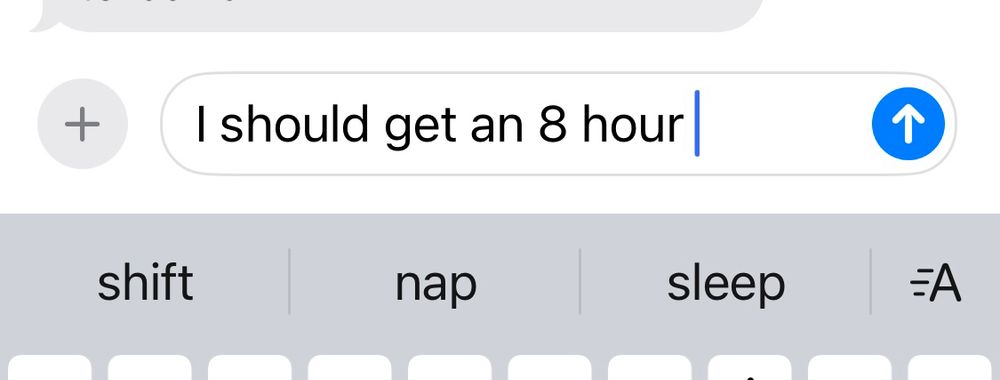 A text app composition bar shows the word “ I should get an eight hour” and the auto complete suggestions are “shift”, “sleep”, and “nap”.