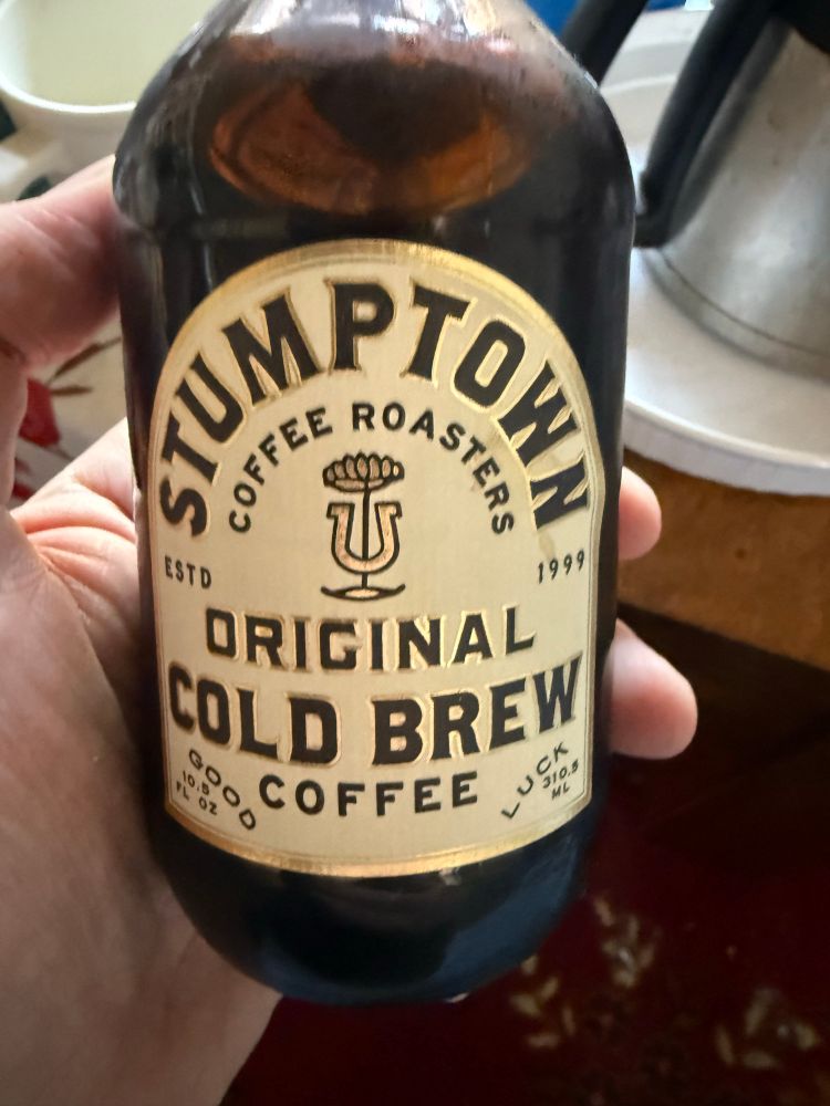A bottle of Stumptown original cold brew coffee, in mah hand. 