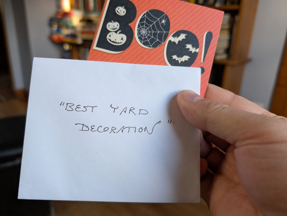 A card that says BOO!, and an envelope which says "Best Yard Decoration"