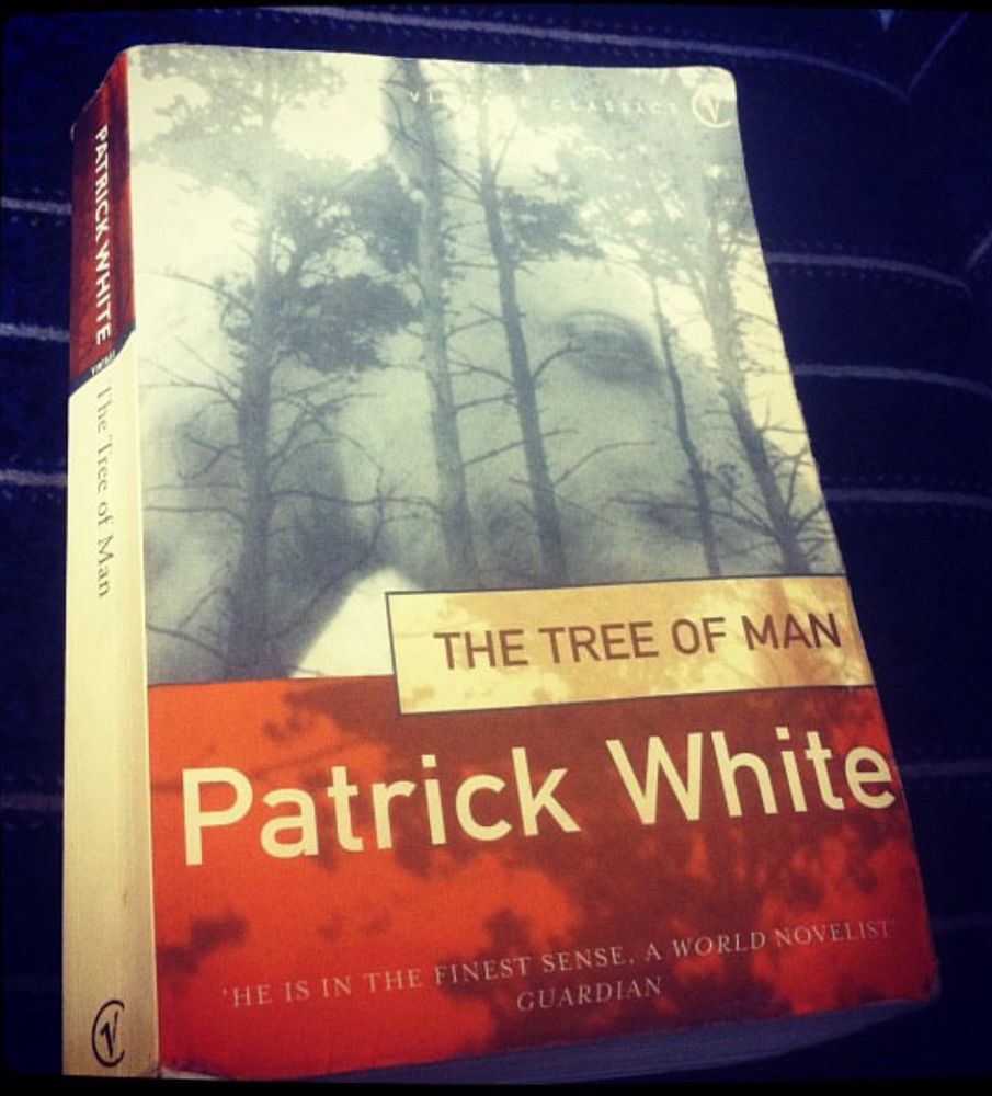 A paperback copy of The Tree of Man by Patrick White