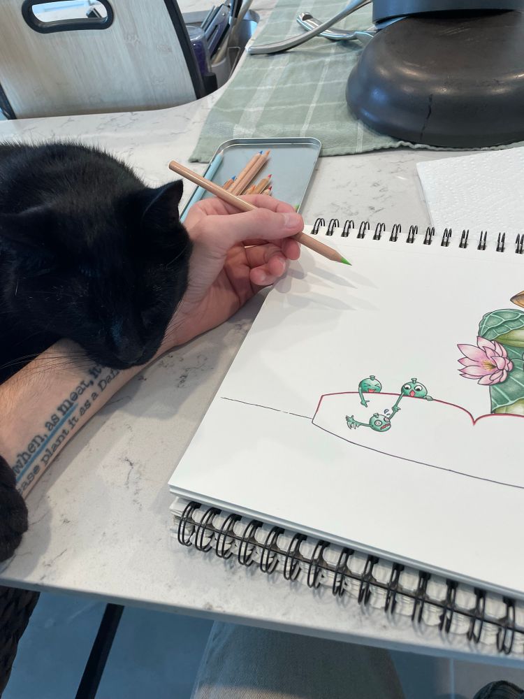A picture of my black cat Klinsi deciding to sleep on my drawing arm while i work on the Lotuswain drawing.