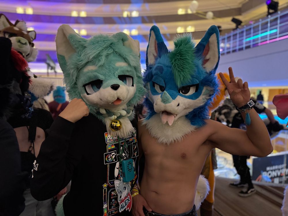alex poses with mango wearing tecario’s suit head