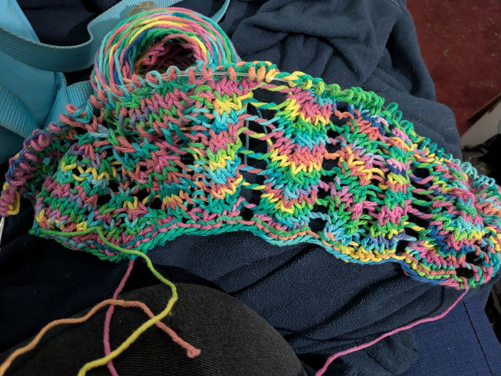 The start of a scarf with rainbow thread