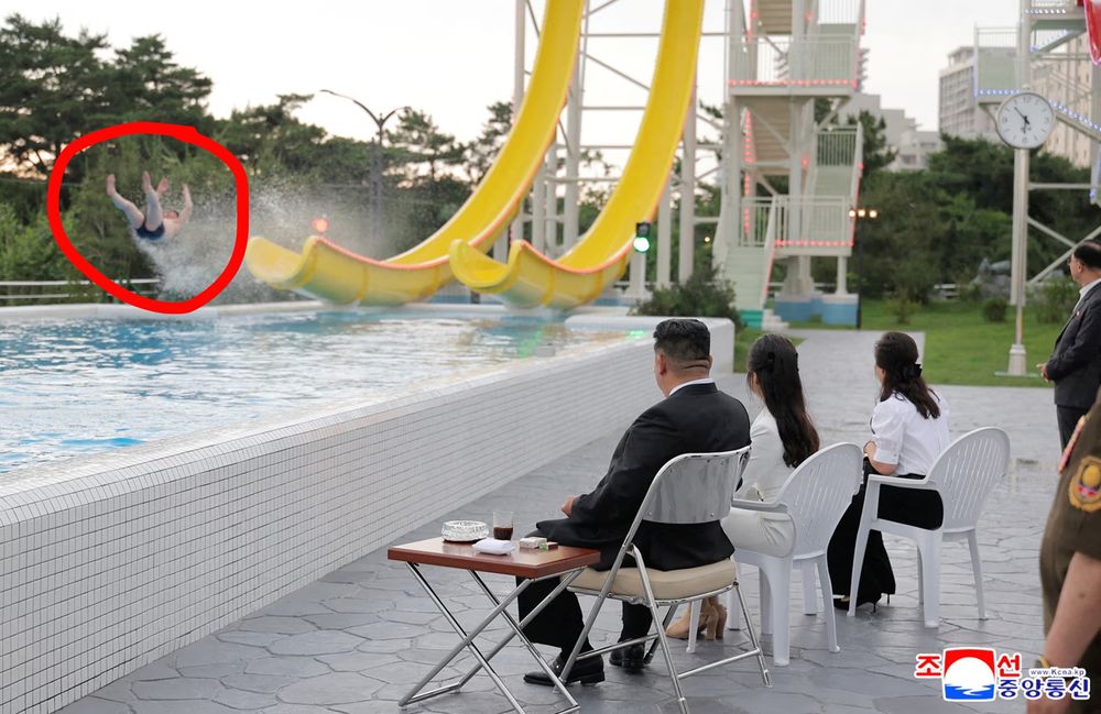 photo of a person coming off a waterslide with kim jong-un nearby