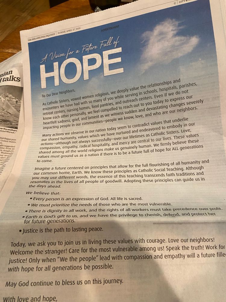 Closeup on the text of an add in todays Inquirer calling on us to change direction