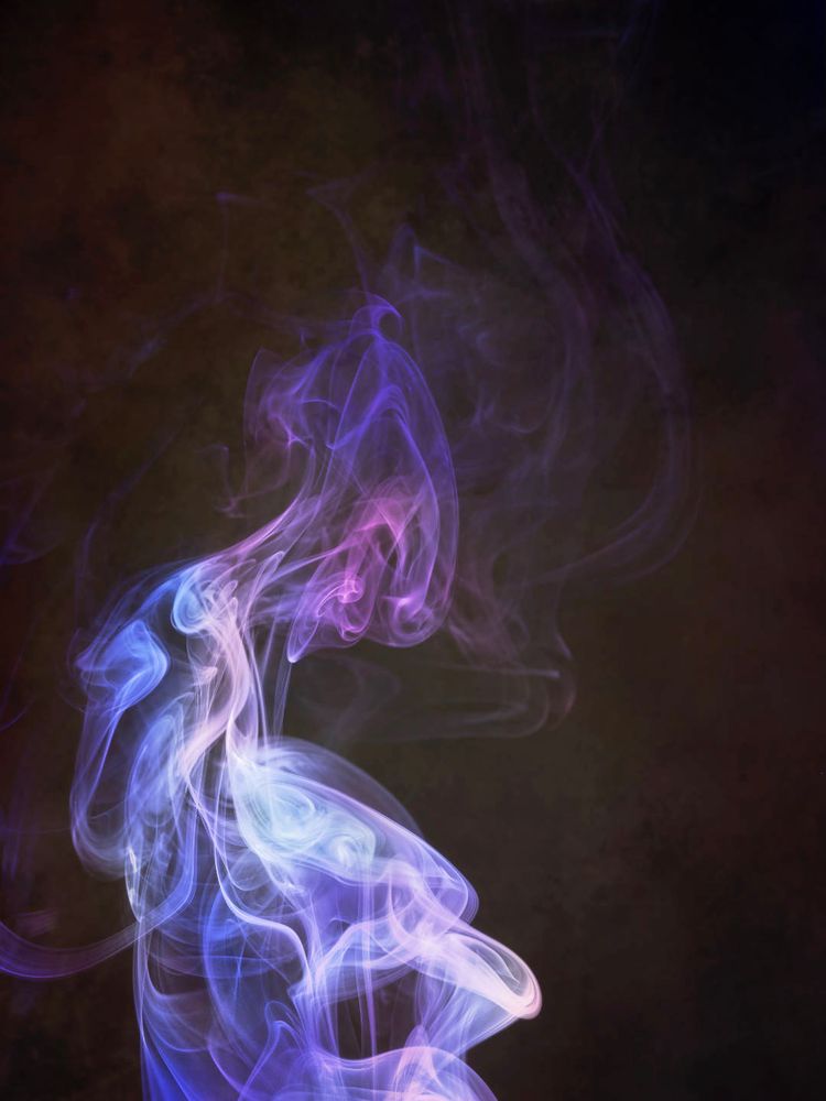 a smoke image of a translucent smokey humanoid sitting and staring at their distended swirly stomach. the backgound is darkish mottled brown ... the figure in pinks, pale pinks and blues, with violet hair.
