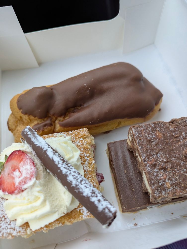 Our dessert selection which was only 10€!

An eclair, strawberry sponge with cream, a rocky road tray bake and a Carmel shortbread tray bake.