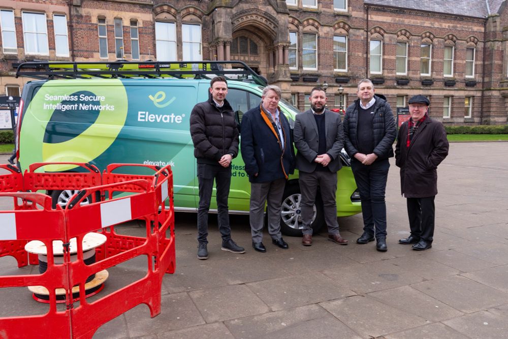 Representatives from Elevate and St Helens Borough Council's Cabinet, next to an Elevate van, outside St Helens Town Hall