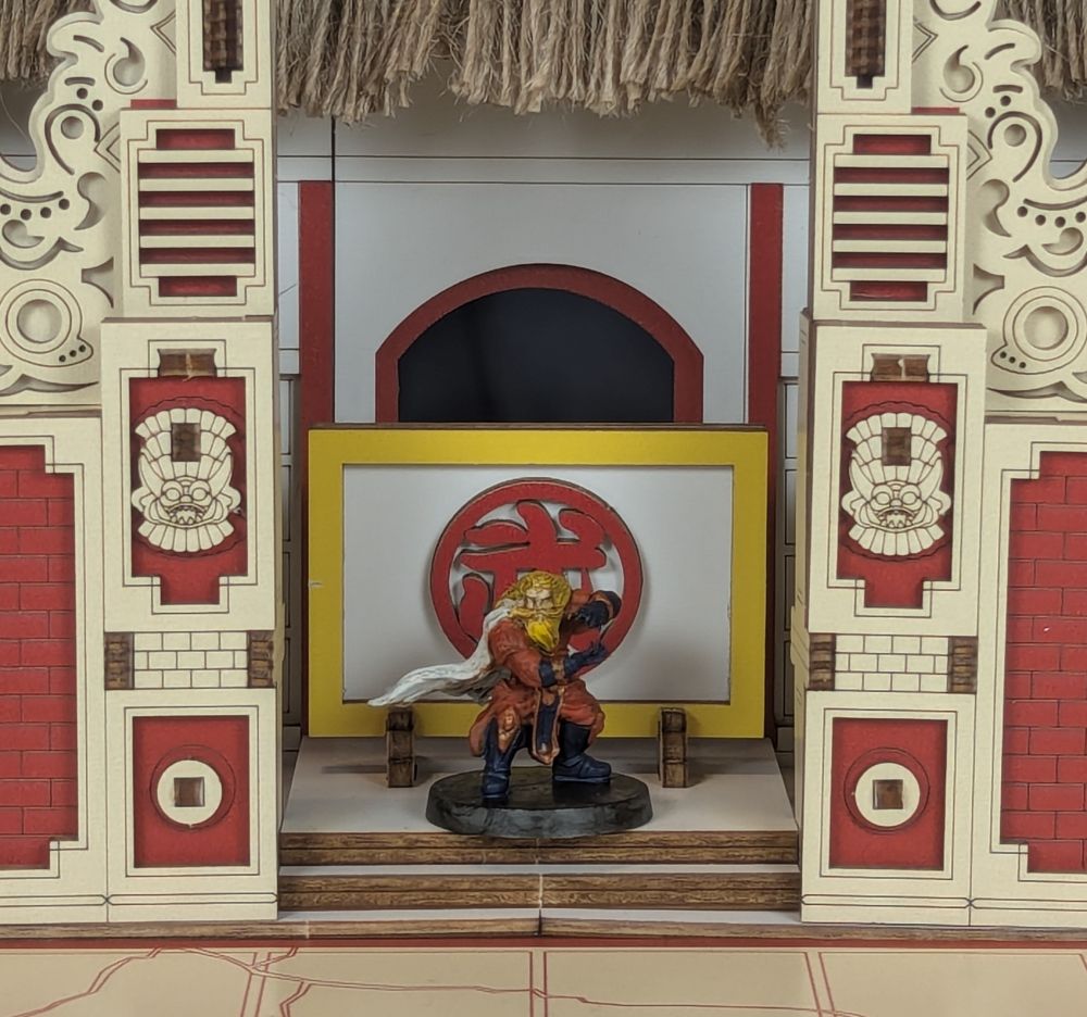 The orange monk, posing in the arena entry way 