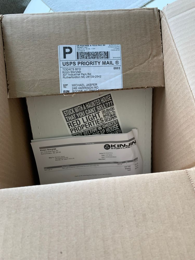 The boxes for Red Light Properties: Unfinished Business by Dan Goldman.