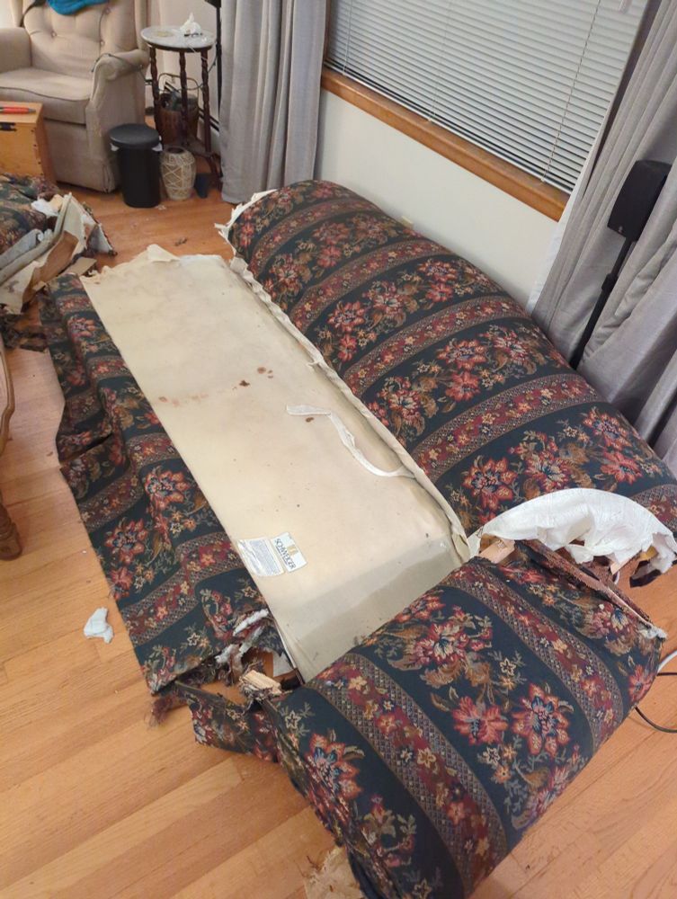 Structurally, both the second arm and back are removed here, but the couch fabric hasn't accepted what's coming yet.