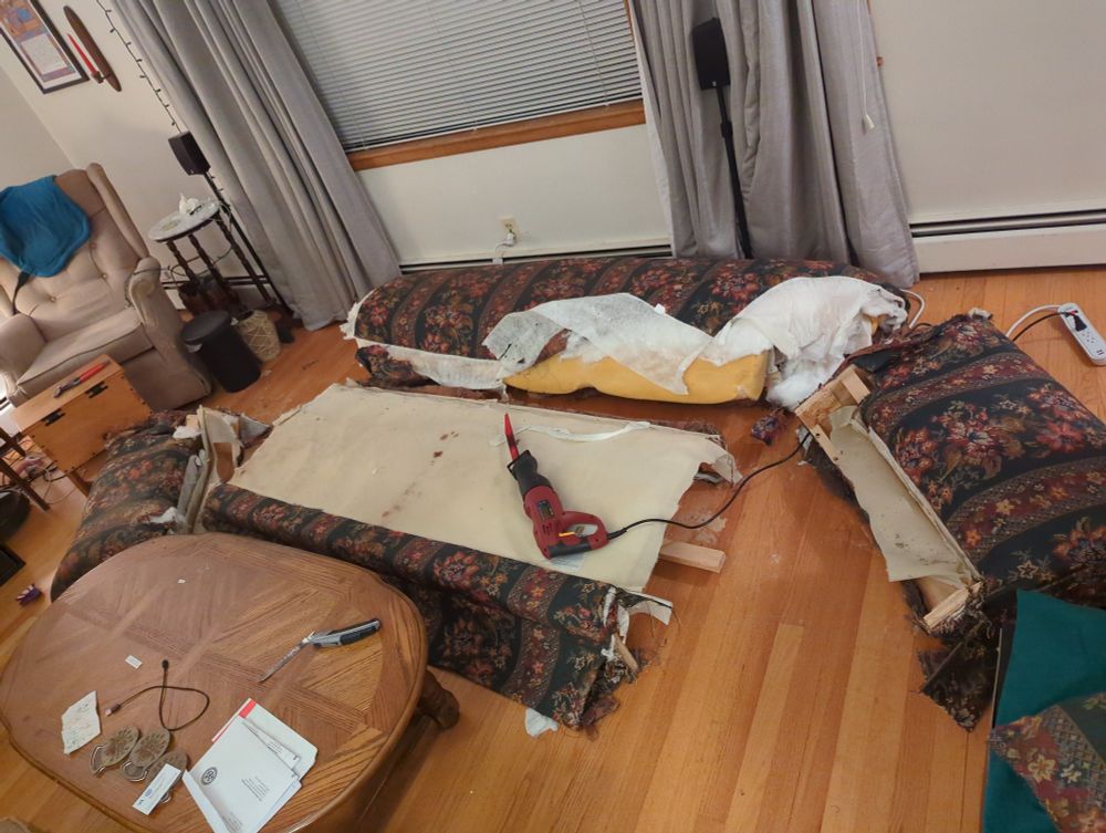 Only 2 tools required, a reciprocating saw & a utility knife, though I did also use pliers to peel back the upholstery as there are nails every inch or so...  The picture has both arms, the couch back, and the seat, taking a little nappy nap separately.  My cheap-ass reciprocating saw is lying on the couch seat & the utility knife sits on the coffee table.
