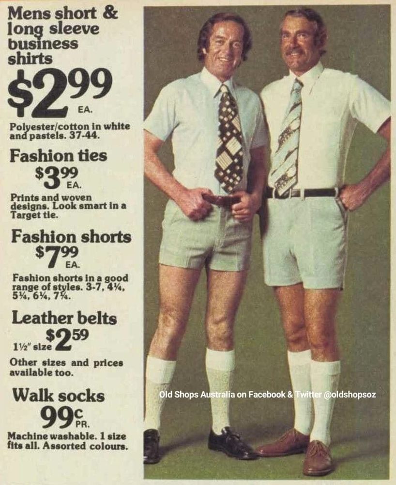 An advertisement from the 1970s in New Zealand, showing two middle-aged (or maybe in their 20s, people in the past looked weirdly OLD) guys wearing leather shoes, white socks pulled up, short sleeved shirts with wide ties, and closely tailored shorts which come down to just above mid thigh on them.