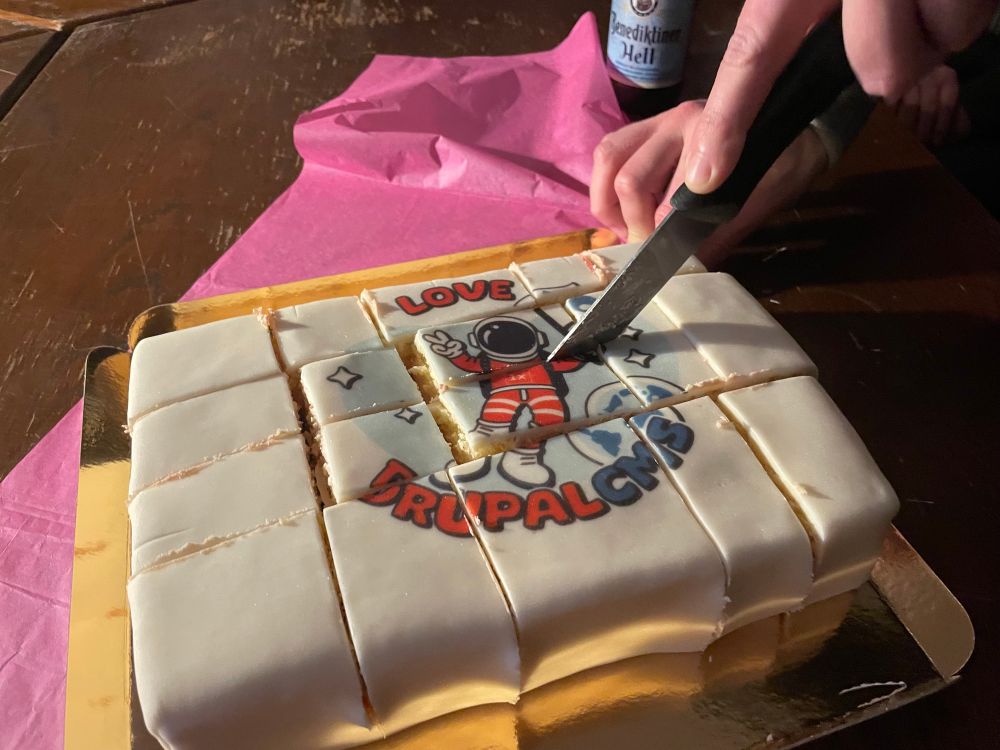 Person slicing a cake with a knife