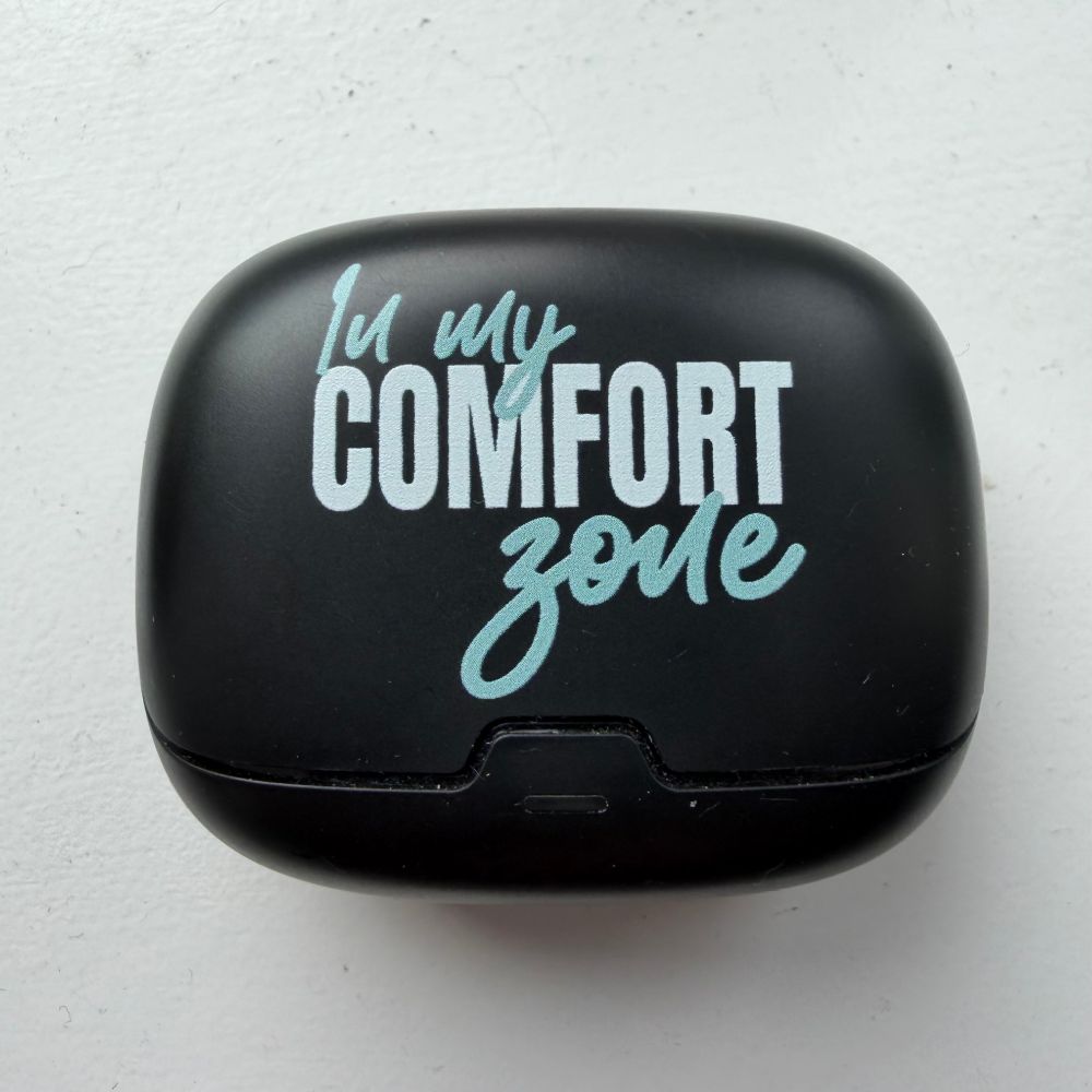 Ale-Hop earbuds case, black with “in my comfort zone” written on it. 
