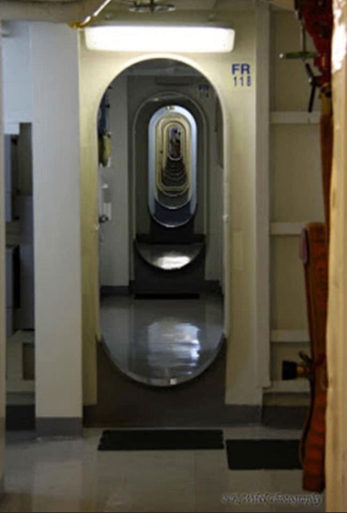 Passageway on a ship. The bottom of the openings are called kneeknockers 