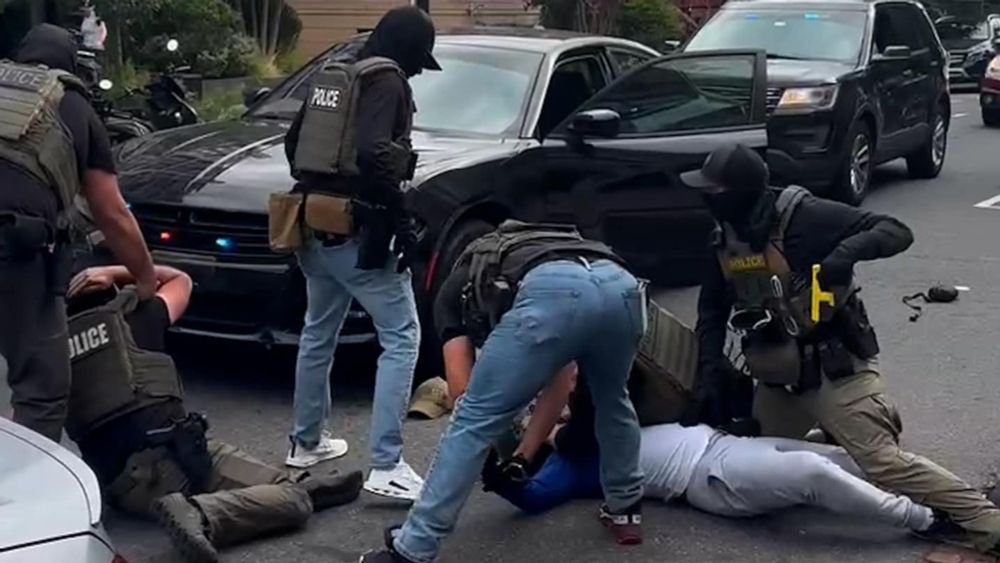 Six agents wearing police vests without clear identification of their agencies detained a man they later identified as a Venezuelan national in Northwest Washington.