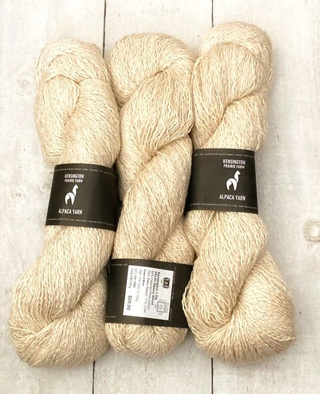 2 skeins of rich cream coloured alpaca yarn. 