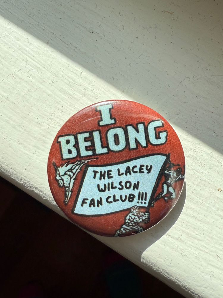 picture of a red button that says I belong the lacey wilson fan club 