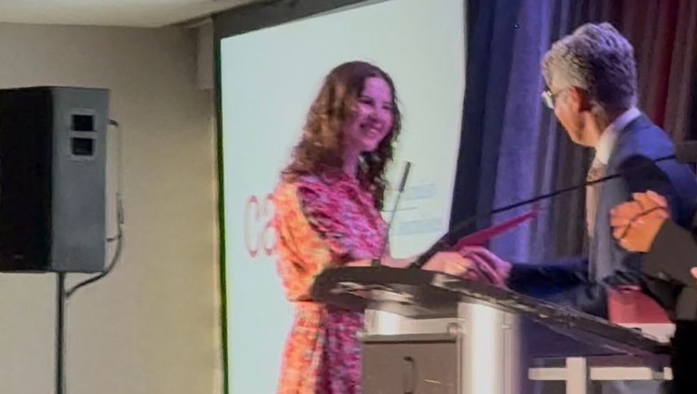 Emma Arkell accepts journalism award 