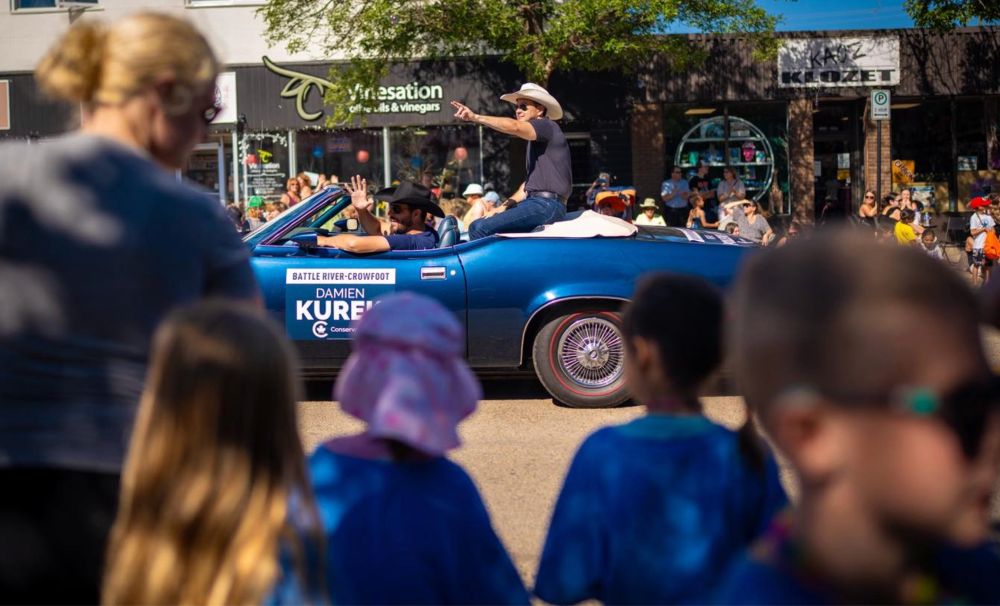 Pierre Poilievre makes appearance at the Kickin’ Country Parade in Camrose, Alberta in a car with a different candidate's name on it (Pierre Poilievre, Facebook)