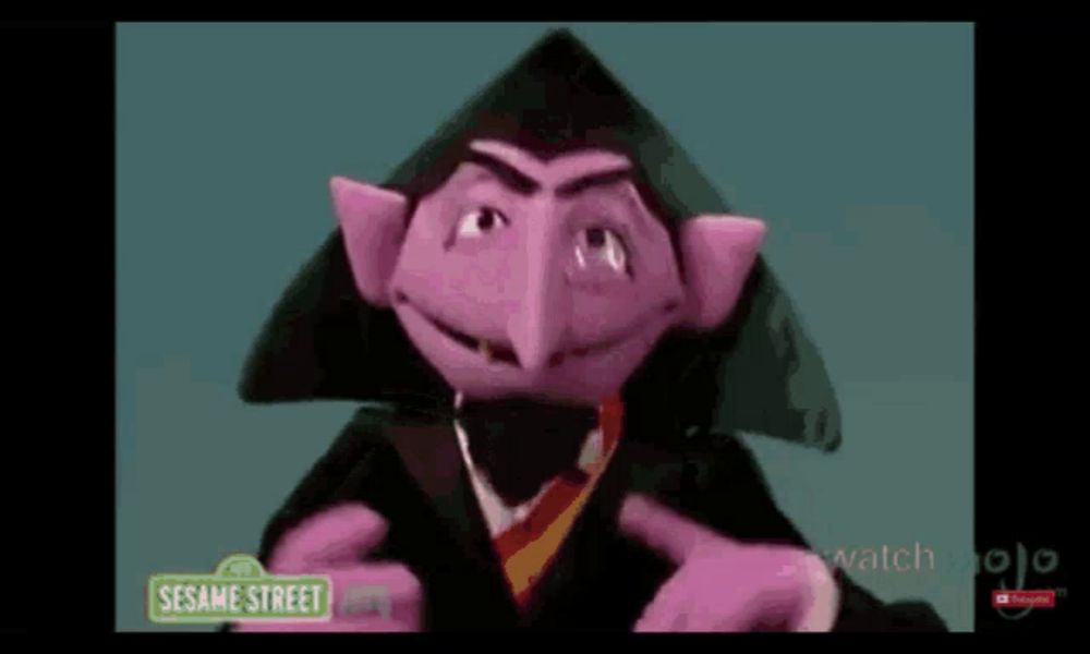 count von count from sesame street is pointing at the camera