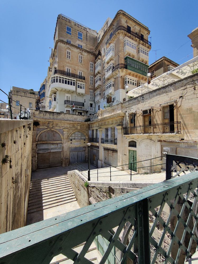Photo of Valletta and steps leading down towards Victoria Gate, taken from the bridge