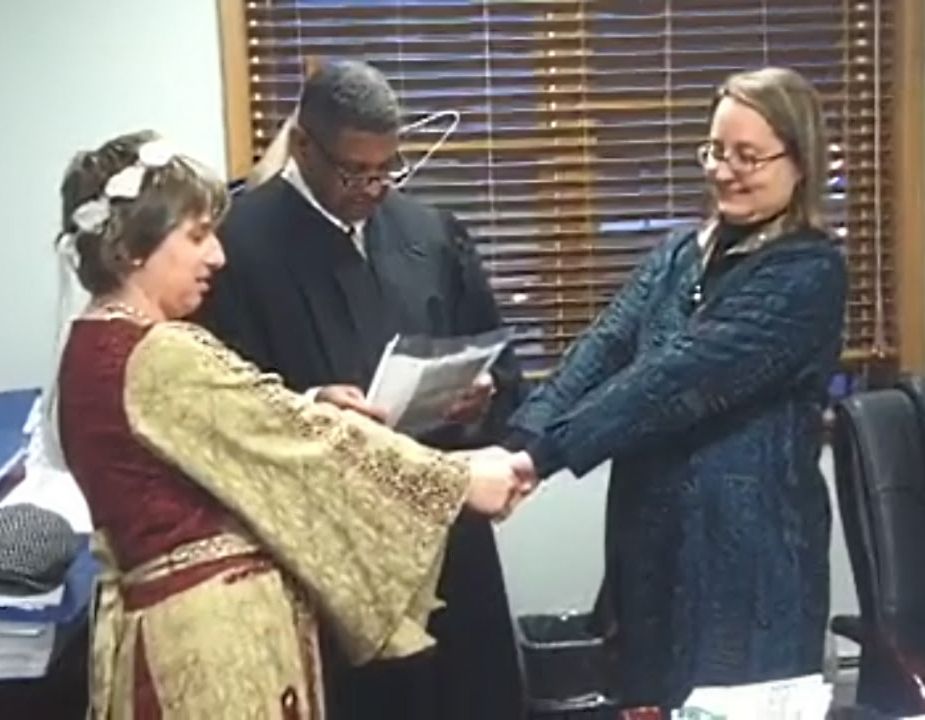 I'm on the left, wife is on the right, and a confused judge is in the middle 