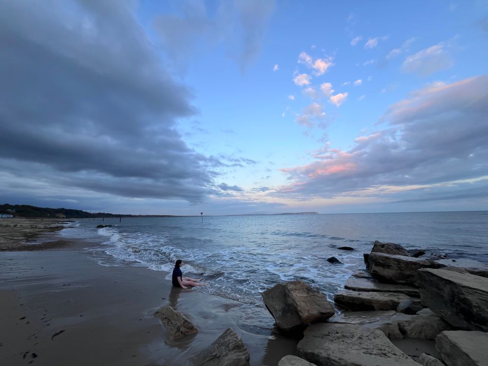 View of the sky above the sea and a bit of the beach 