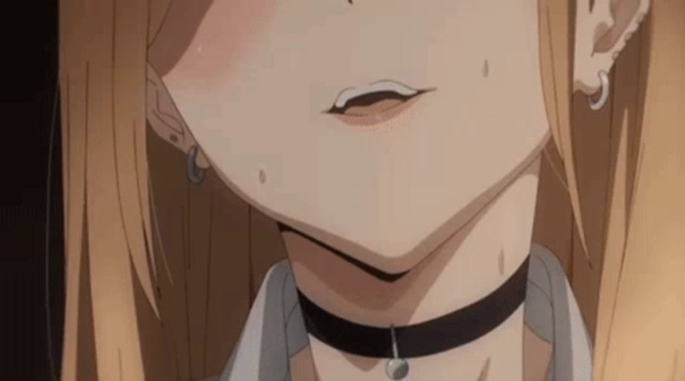 a close up of a girl 's neck with a choker and earrings