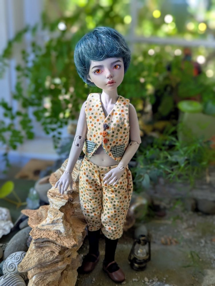 Ball jointed doll Iplehouse KID Hannah in grey, wearing a dotted set of knickerbockers and matching waistcoat with black stockings and dark faux leather shoes. 